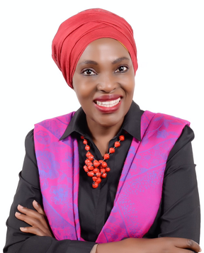 A headshot of Rehmah Kasule smiling and looking at the camera